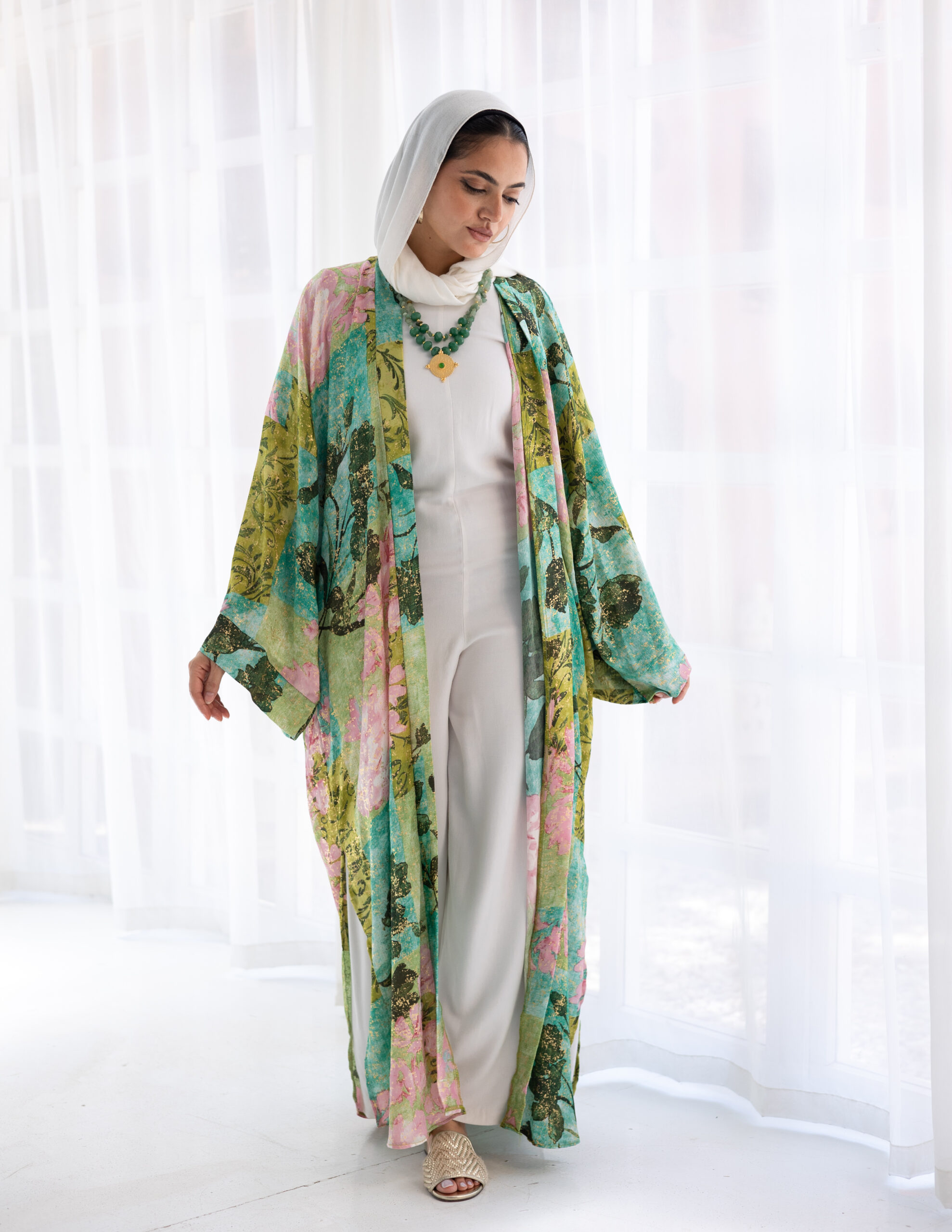 The Muse Kimono is a flowing statement of ease and quiet luxury. Crafted from a soft, fluid fabric, it’s designed to drape gracefully with every movement. Subtle touches of gold elevate the piece—catching the light and adding a refined hint of radiance. With its wide sleeves and open silhouette, Muse is ideal for layering over both relaxed and polished looks. A signature from Everyday Grace – Wave II, it reflects strength in softness and beauty in the understated.